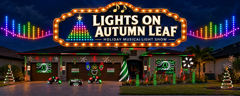 The Lights On Autumn Leaf house lit up at night with a marquee sign, singing tree, light trees and LED screens
